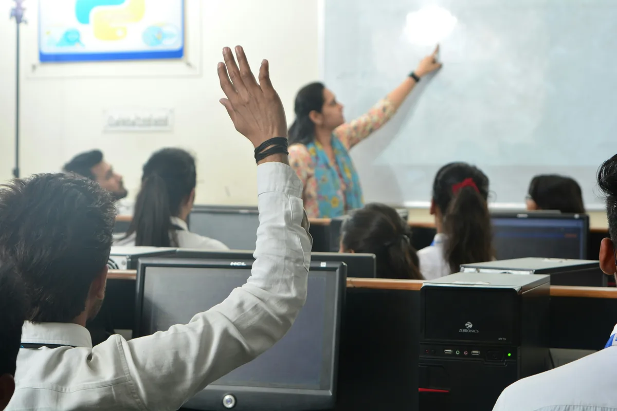 Students using computers representing school management software